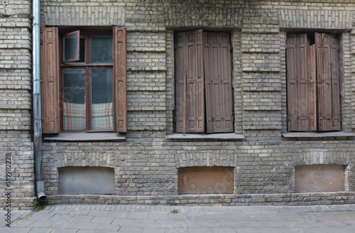 Old European classic building three windows facade © david_leshem