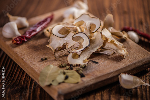 Dried porcini mushrooms on a wooden table. Food background. Rustic style.