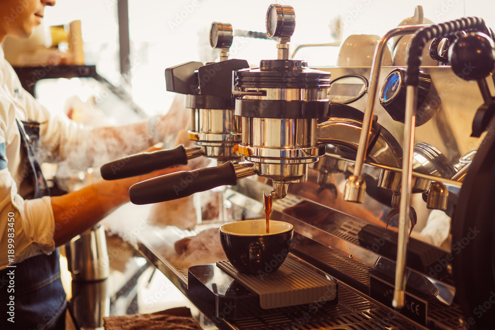 barista make coffee latte art with coffee espresso machine in