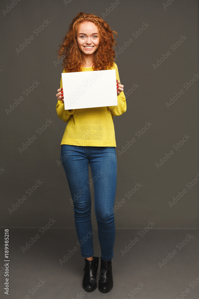 Young happy woman with blank white paper Young happy woman with blank white paper
