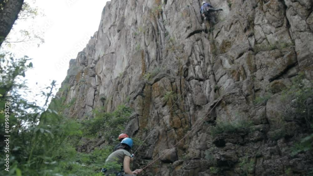 The climber makes the ascent. Training camp of climbers. The climber makes the ascent. Training camp of climbers.