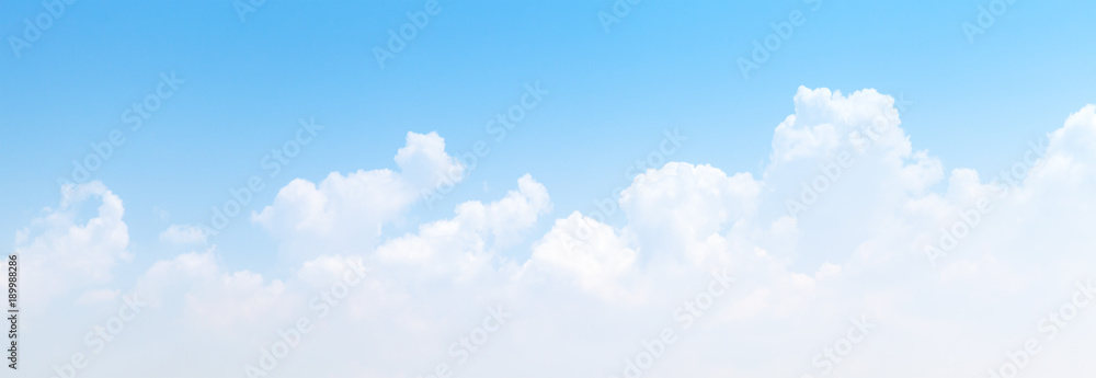 Fototapeta White cumulus clouds formation in blue sky