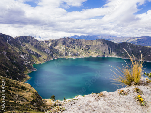 Turquoise waters of Quilotoa lagoon, volcanic crater lake in Ecuador 