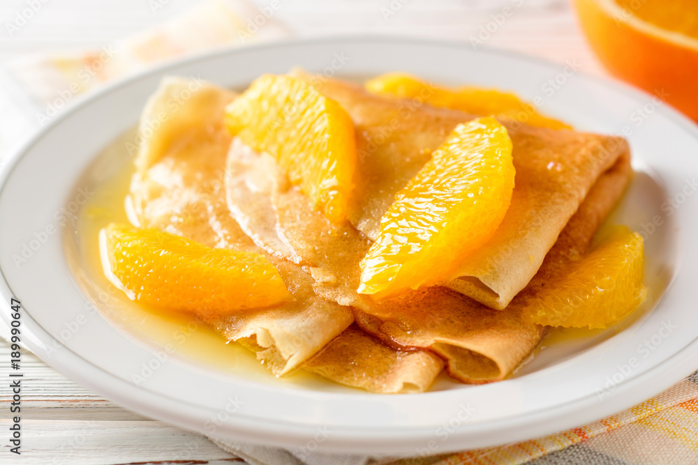 Crepe suzette, traditional french dessert with thin pancakes and orange sauce. Crepe suzette, traditional french dessert with thin pancakes and orange sauce.