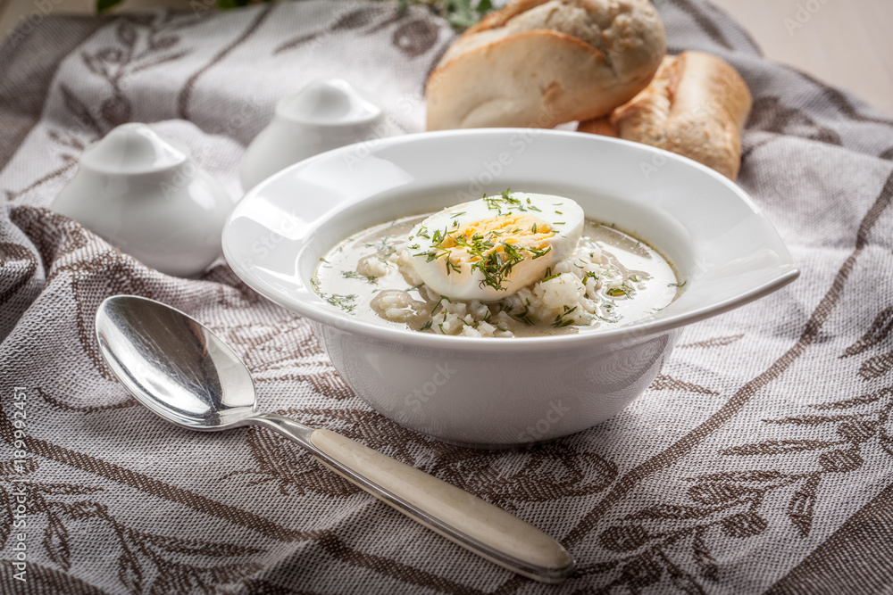 Sorrel soup with egg in white bowl. Sorrel soup with egg in white bowl.