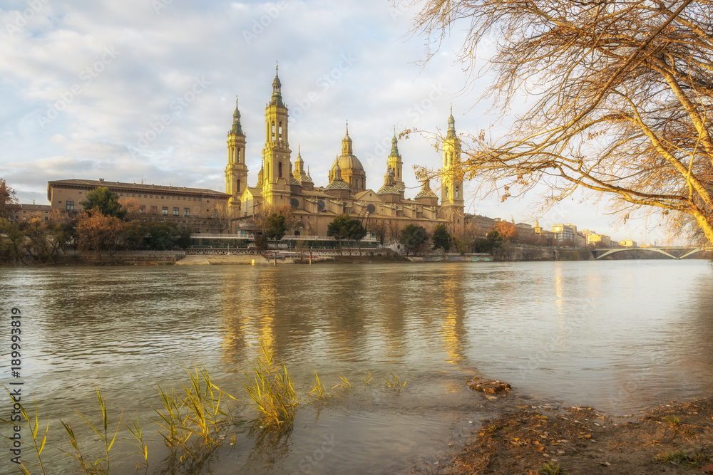 Cathedral-Basilica of Our Lady of the Pillar in Zaragoza. View from the Ebro River at the dawn, Spain.