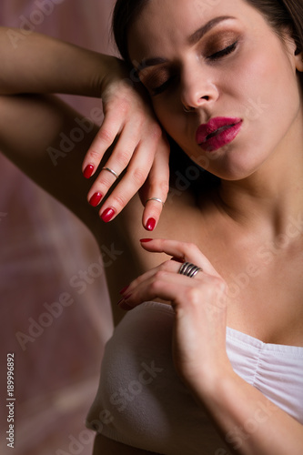 Beautiful young woman wearing a set of silver jewelry