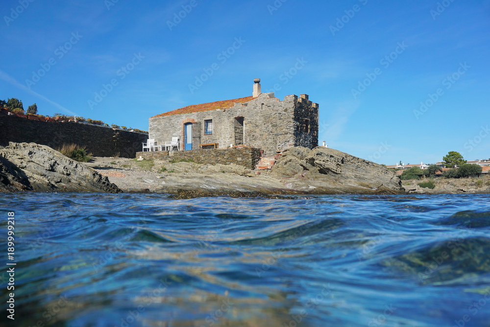 Old stony house on the seashore of the Mediterranean sea, Cadaques, Costa Brava, Catalonia, Spain
