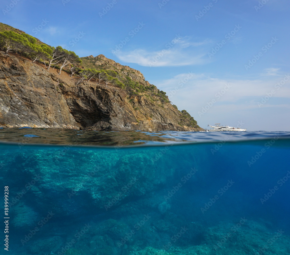 Over and under water surface, cliff with rocks underwater, Mediterranean sea, Cap Norfeu, Costa Brava, Spain, Cap de Creus, Girona, Catalonia