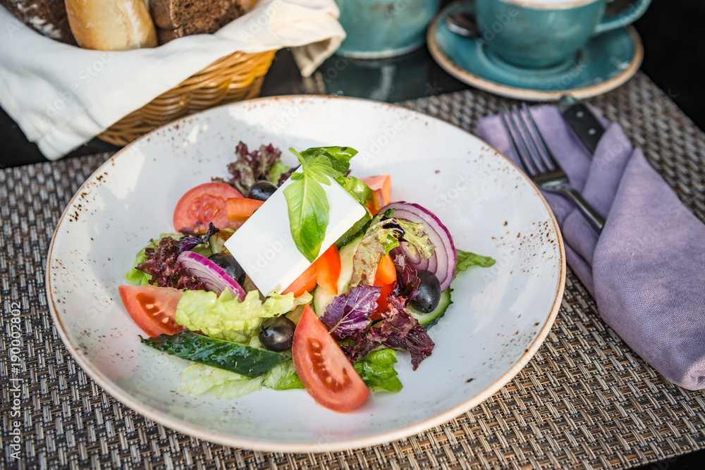 Greek Salad in Plate in Sunrays Greek Salad in Plate in Sunrays