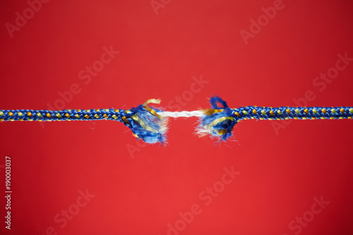 Frayed rope - tension, stress and risk concept