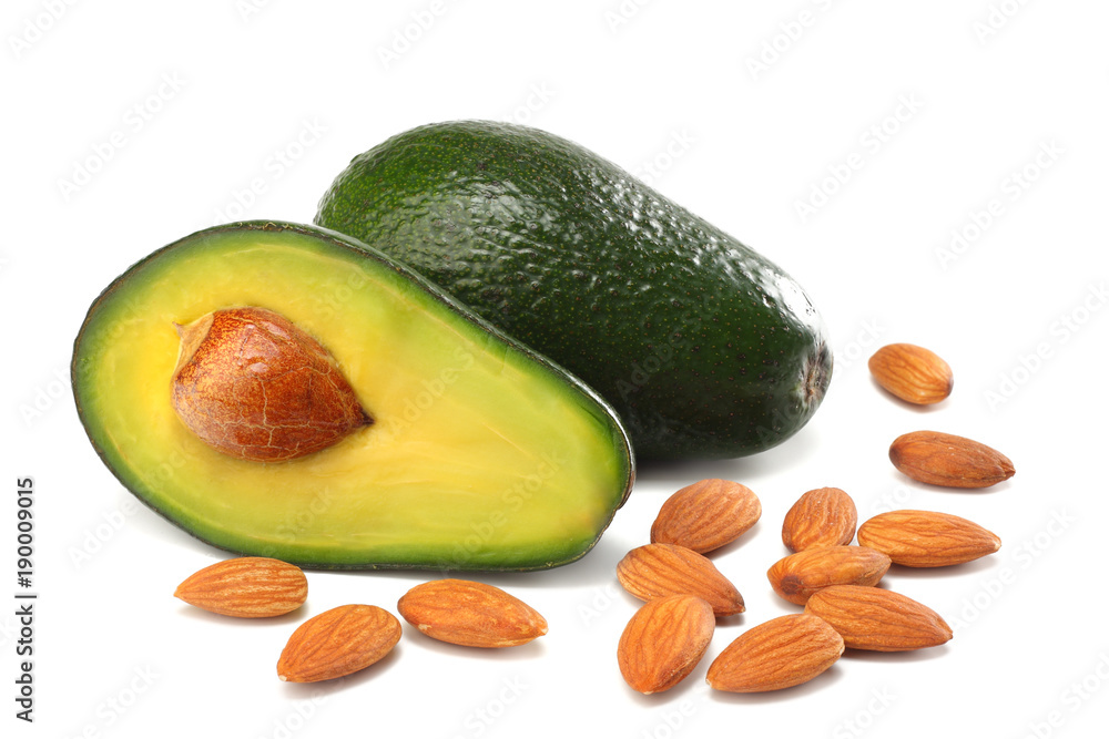 healthy food. sliced avocado with almonds isolated on white background healthy food. sliced avocado with almonds isolated on white background