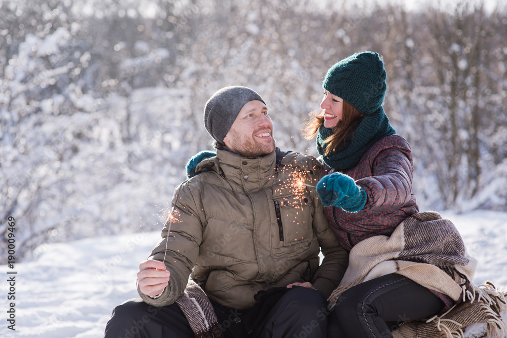 Happy couple with bengal lights outdoors Happy couple with bengal lights outdoors