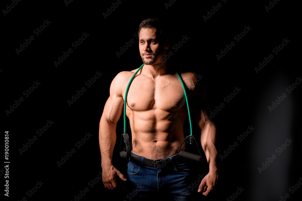 Fitness concept. Muscular and sexy torso of young man having perfect abs, bicep and chest. Male hunk with athletic body. Fitness concept. Muscular and sexy torso of young man having perfect abs, bicep and chest. Male hunk with athletic body.