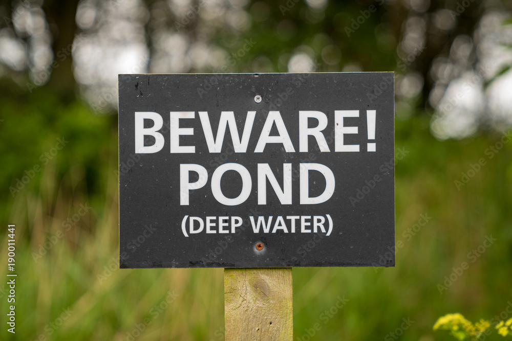 Sign: Beware! Pond (deep water), seen near Bawdsey, Suffolk, England, UK