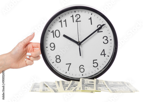 A clock on a female hand and money dollars