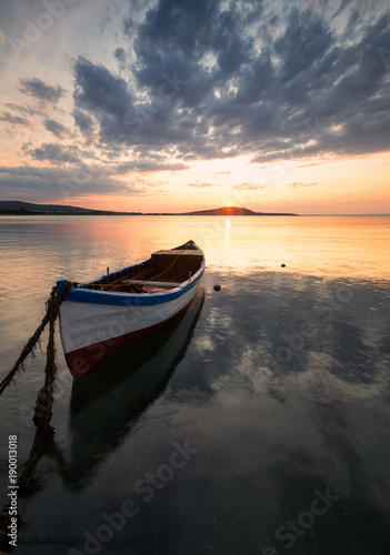 Lonely boat at sunset