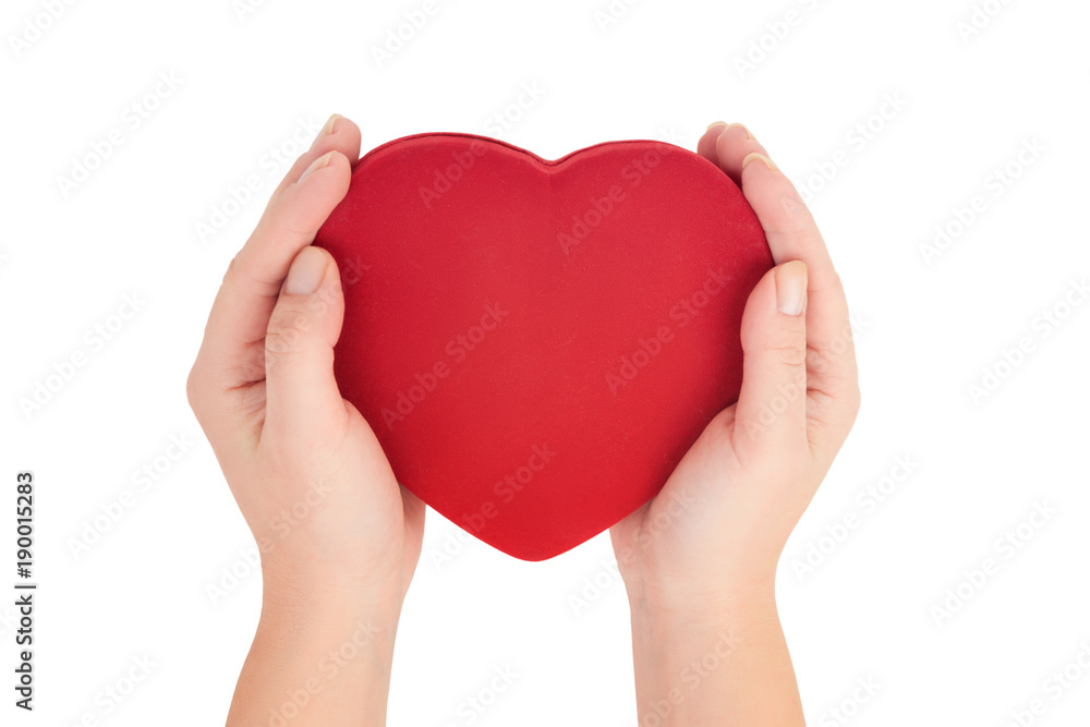 female hands holding bright red heart on white background top view female hands holding bright red heart on white background top view