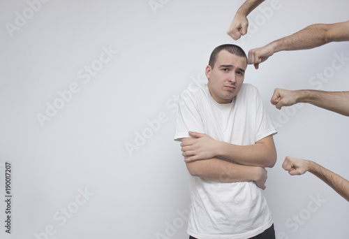 Cuadro en lienzo Weak young scary man trying to defend from arm punches