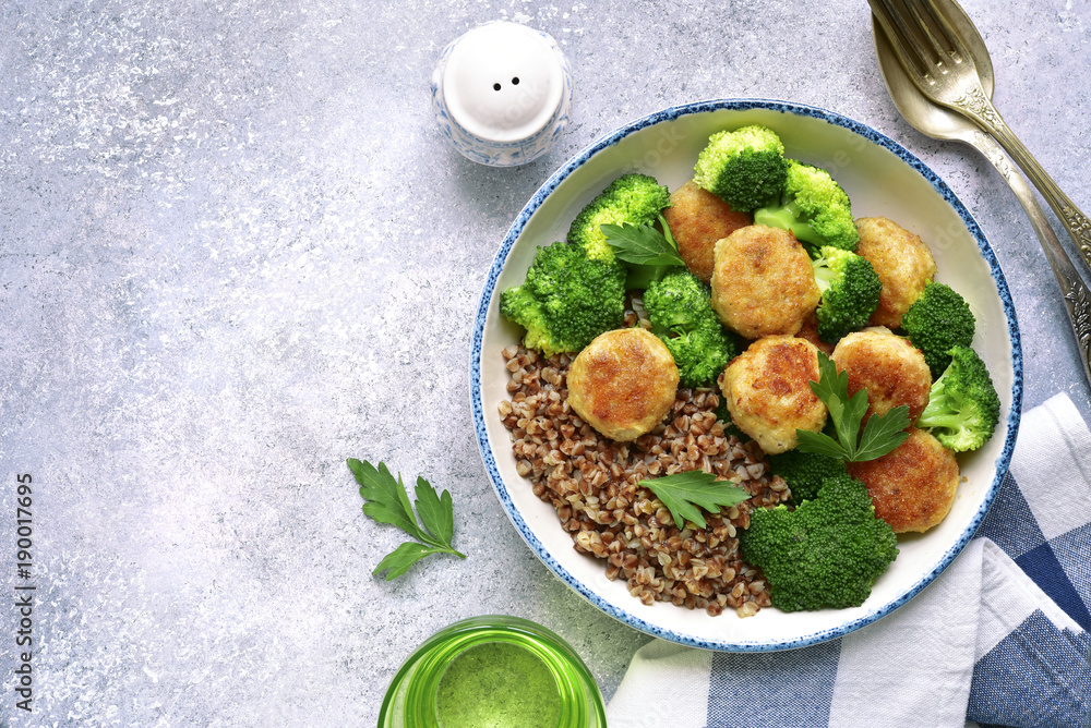 Fotografie Dinner bowl with buckwheat, chicken meatball and broccoli