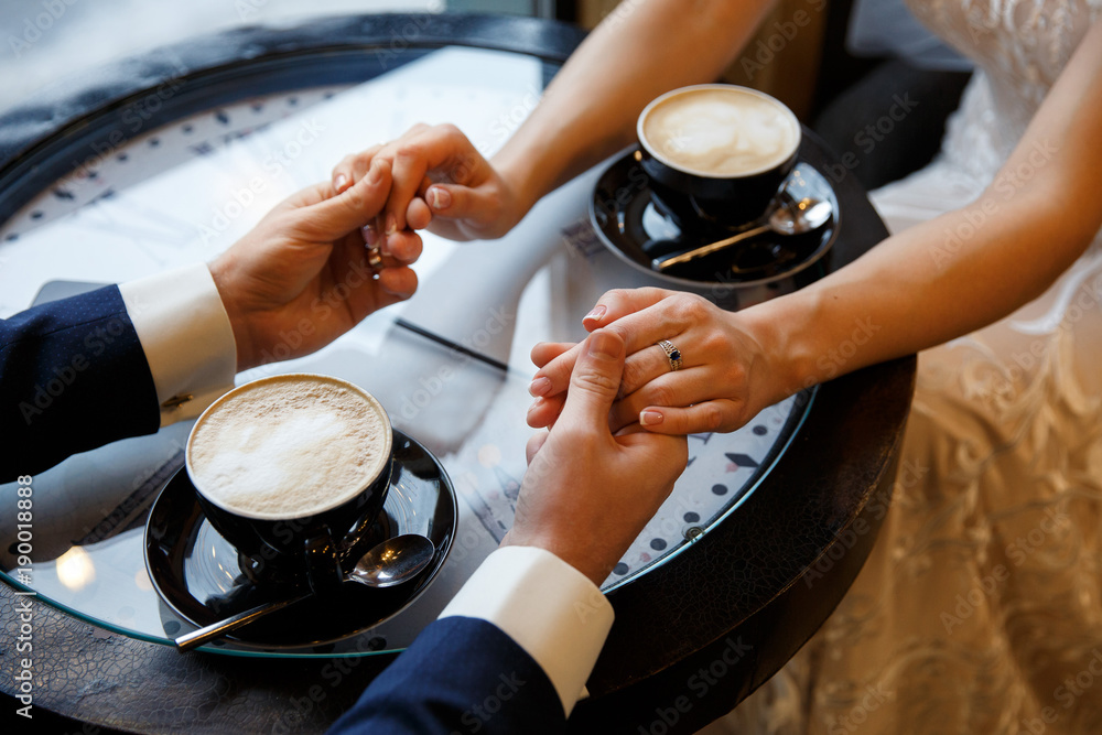 Romantic background, two cups of coffee and hands of couple in love on  date. Romantic dinner in valentine's day Stock Photo | Adobe Stock