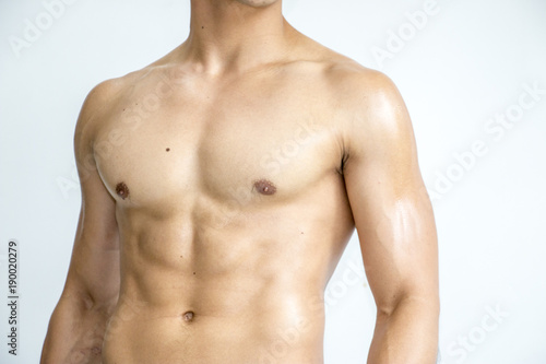 Muscle of body builder on white background