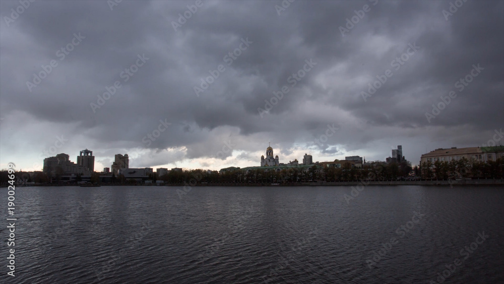 River in the city. Video. Timelapse. Cloudy weather in the city. Gloomy mood, do not want to get out of the house