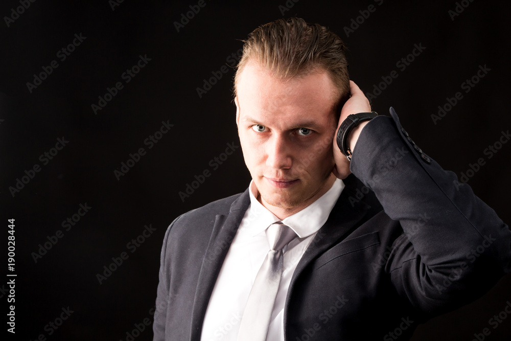 Portrait of handsome businessman on dark background Portrait of handsome businessman on dark background