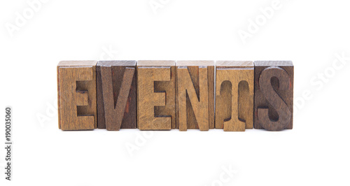 EVENTS spelled in wooden block letters