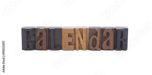 CALENDAR spelled in wooden block letters