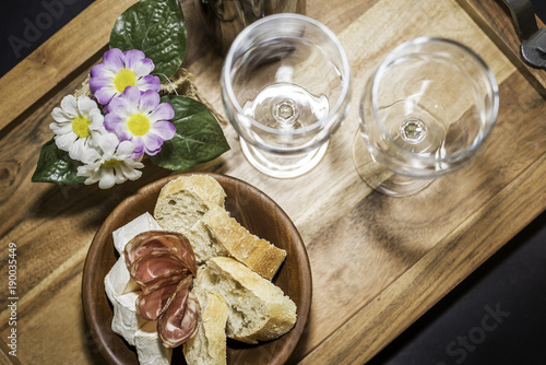 wine grasses & a set of products - cheese, salami, and bread