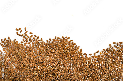 Creative layout made of organic flax seeds isolated on white background. Flat lay. Food concept.