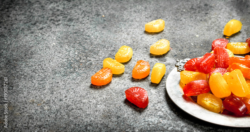 Fruit candies on a steel tray.