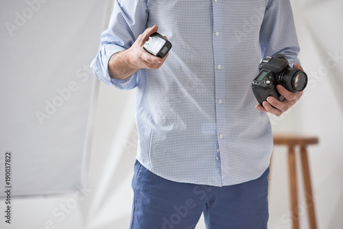 Man holding camera photo