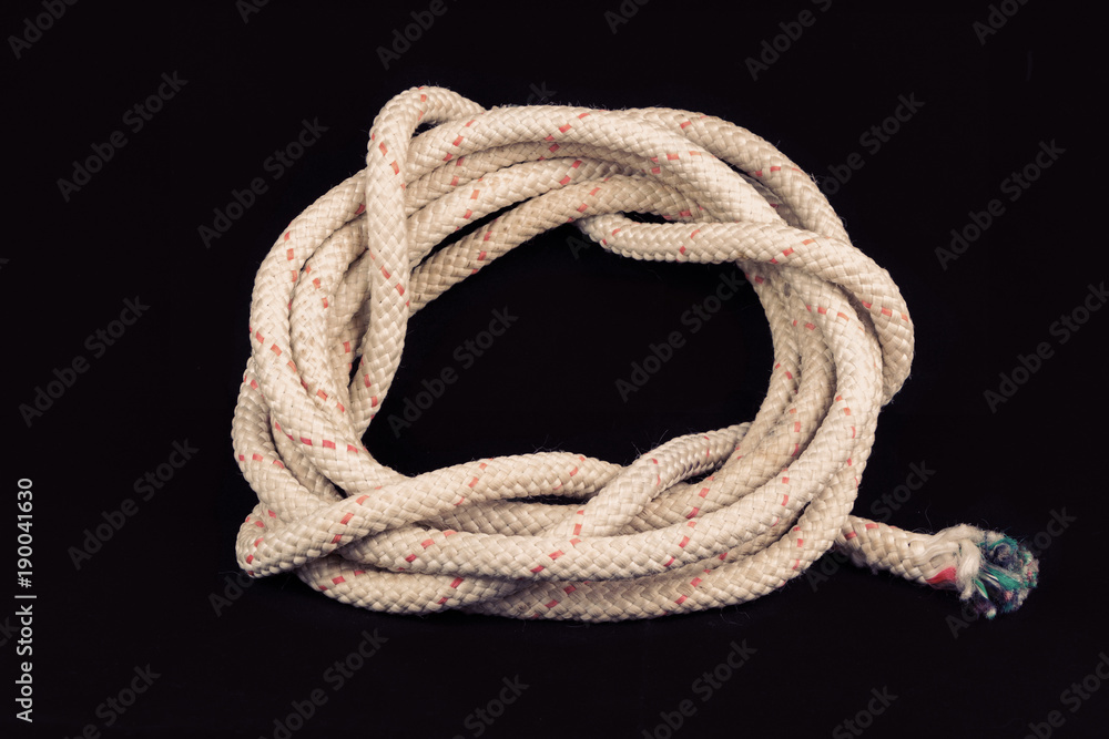 Roll of old rope on black background Roll of old rope on black background