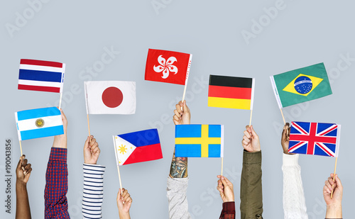 Hands holding a nationality flags photo
