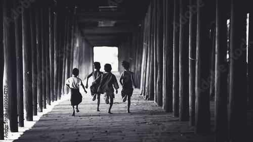 Children runing in the old temple, Salay Bagan Myanmar