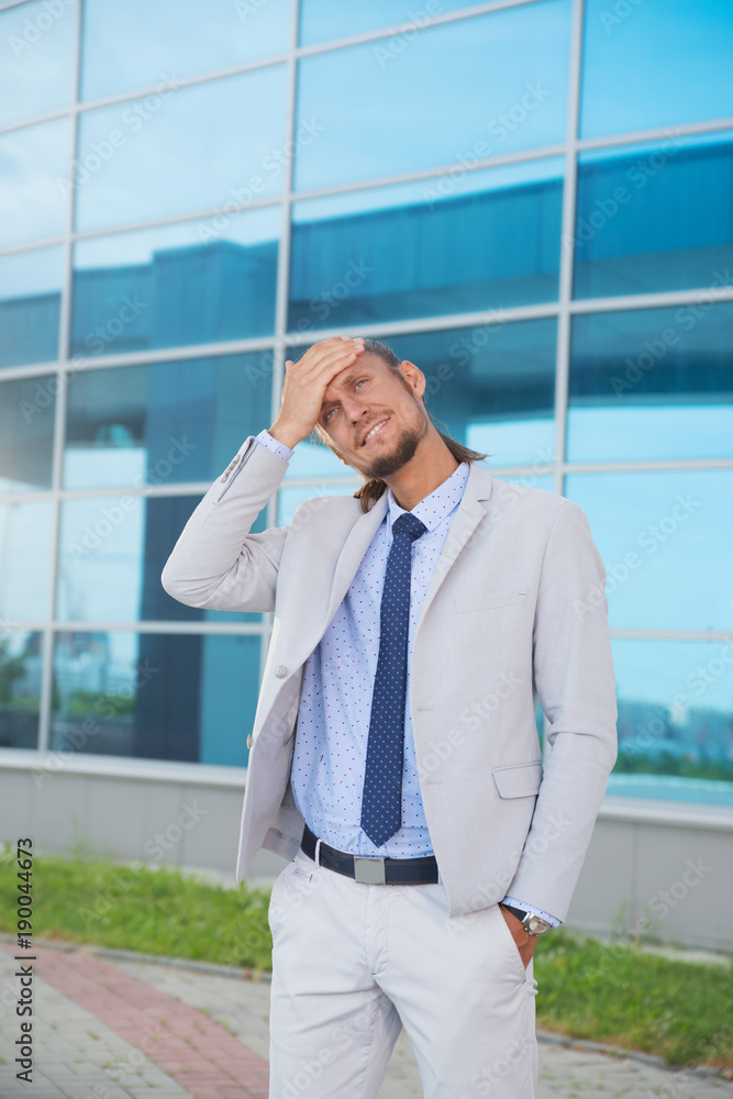 a businessman in a suit around the office a businessman in a suit around the office