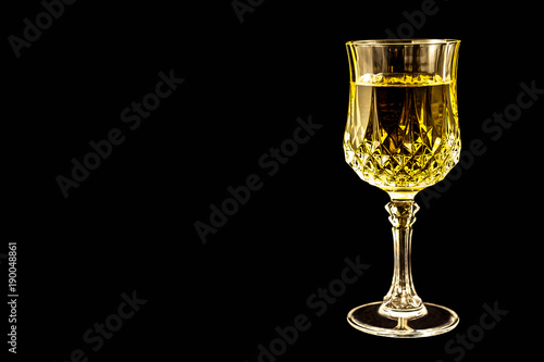 White Wine in a Crystal Goblet ready for relaxation and enjoyment. Chablis, Chardonnay, or Reisling, this glass of wine is ready for tasting. Room for text.