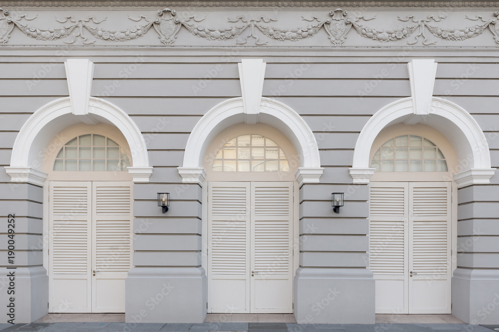 Three arched doors in classic wall Background Stock Photo | Adobe Stock