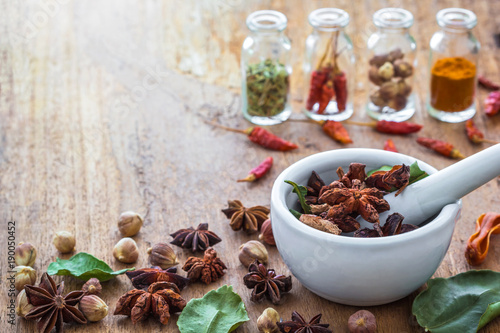 Fotografie Mortar grinder and herb medicine on wood table