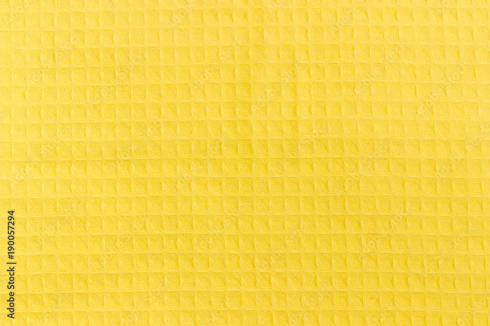Background of the yellow cotton waffle towel Background of the yellow cotton waffle towel