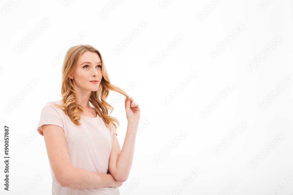 Cute young thoughtful lady standing isolated Cute young thoughtful lady standing isolated