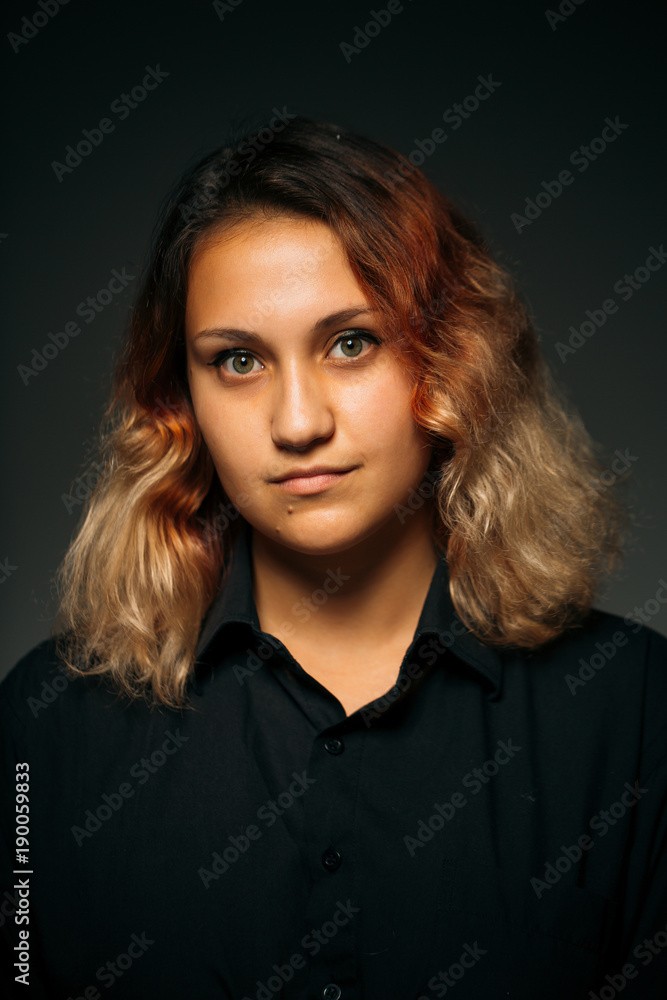 emotional young girl on a dark background