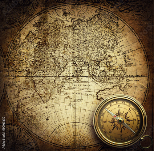 Compass on vintage map. Adventure  travel  stories background. 