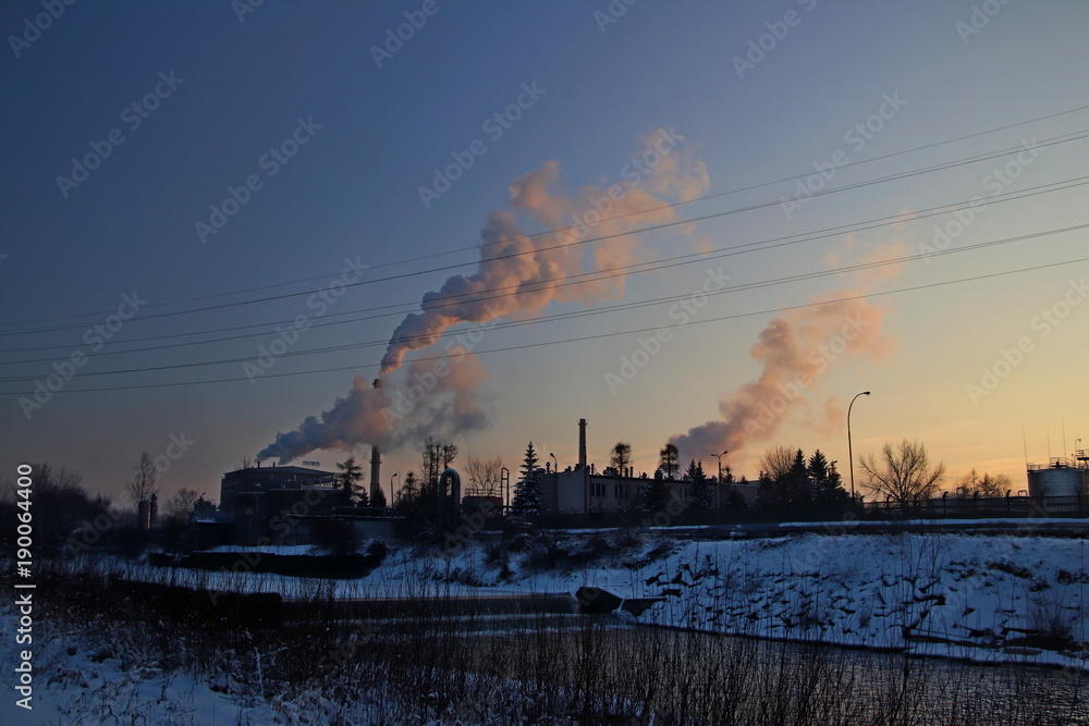 Smoked refinery in sunset. Europe. January 2018.