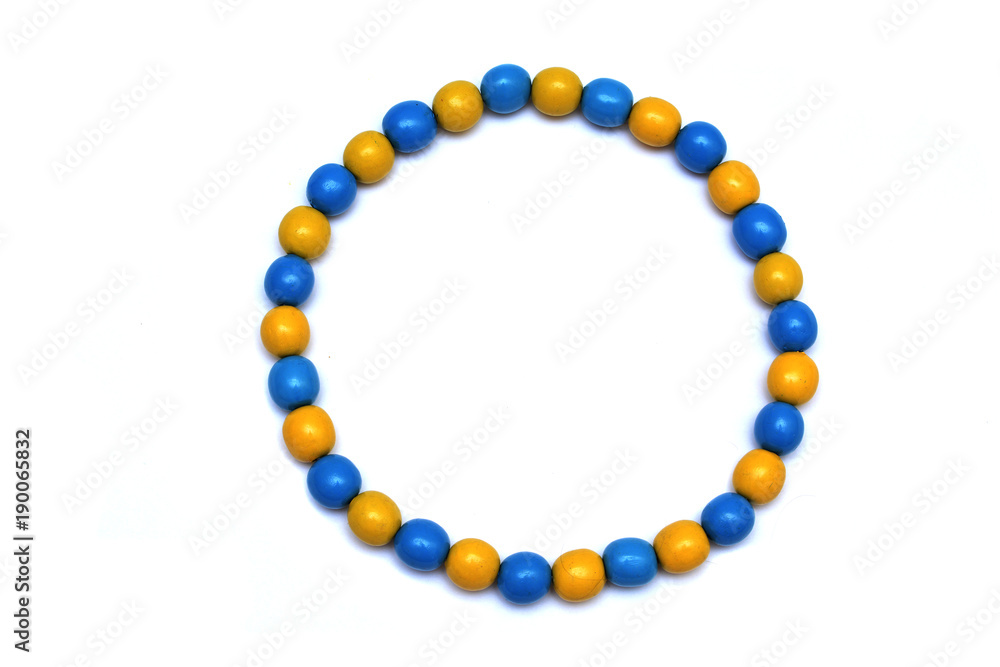 Fototapeta premium Wooden beads handmade on a white background.