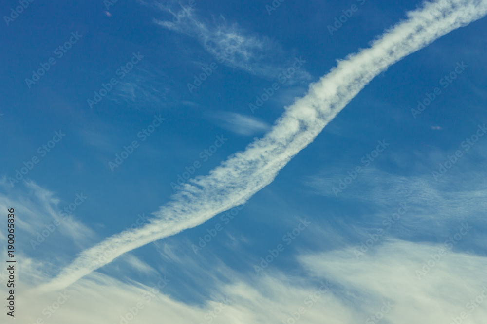 blue sky with cirrus clouds with a strip from the airplane blue sky with cirrus clouds with a strip from the airplane