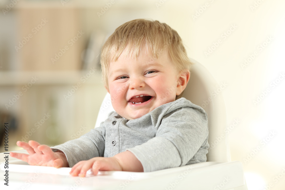 Joyful baby with his first teeth looking at you Joyful baby with his first teeth looking at you