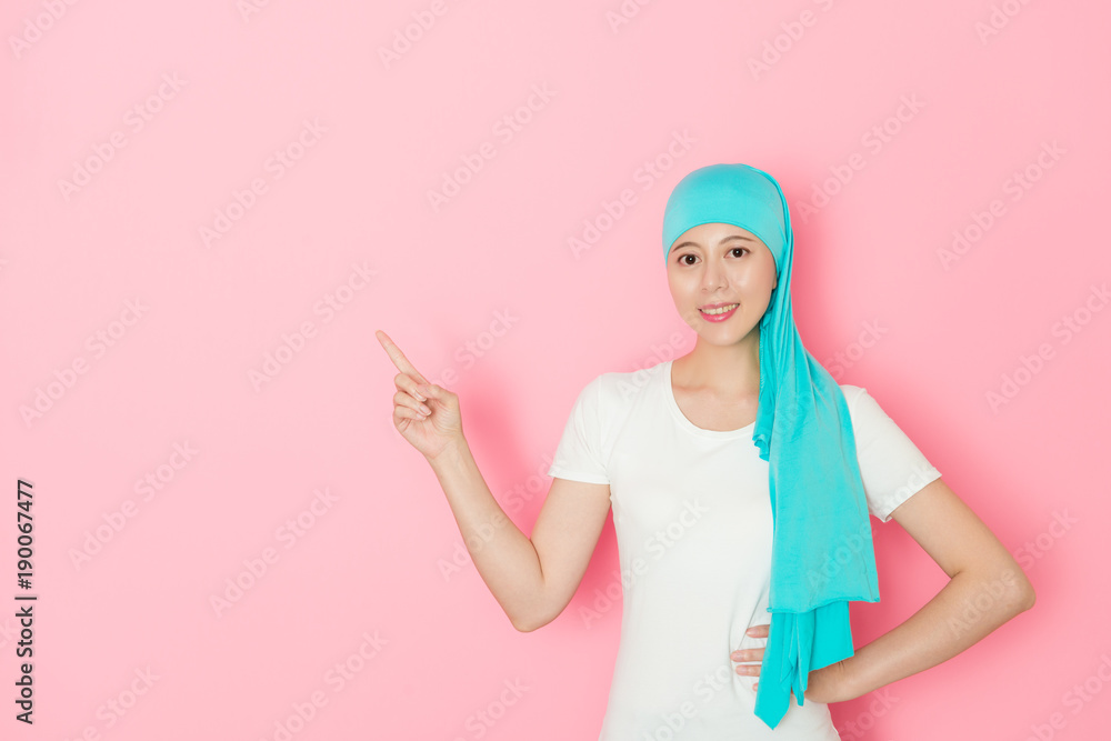 smiling cancer patient standing in pink background smiling cancer patient standing in pink background